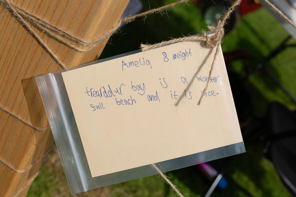 Back of postcard by , age 