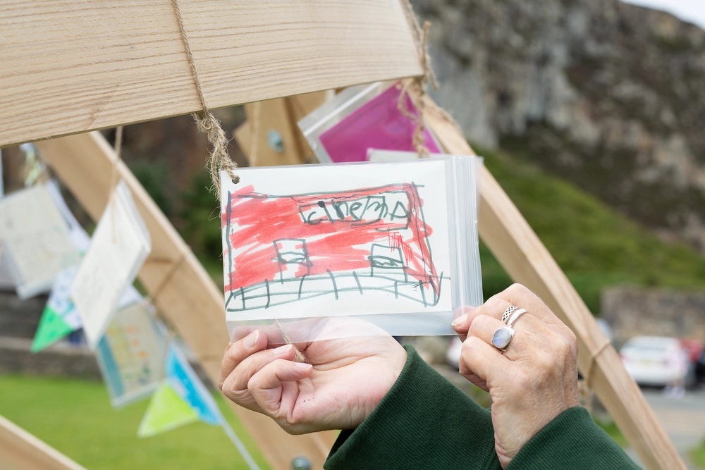 Front of postcard by , age 