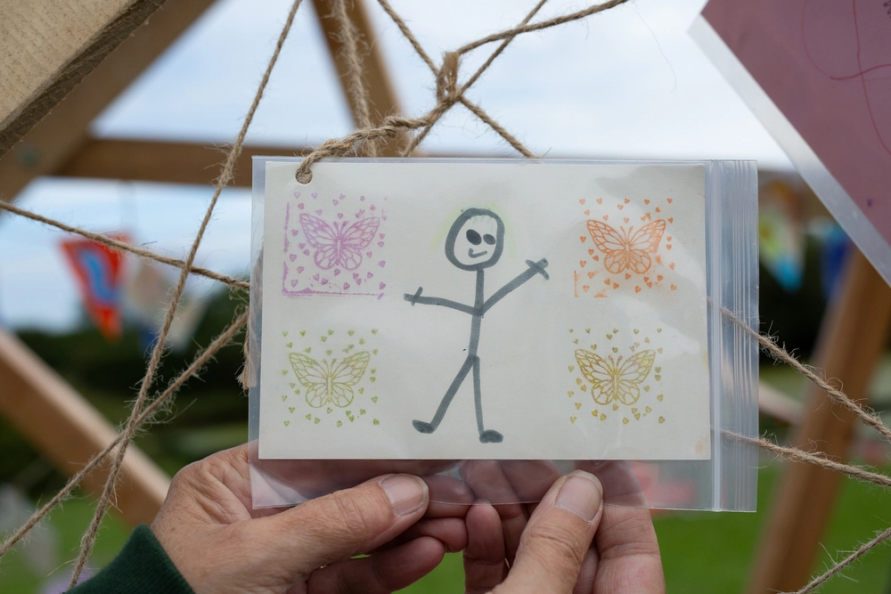 Front of postcard by , age 