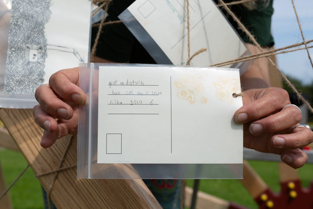 Back of postcard by , age 