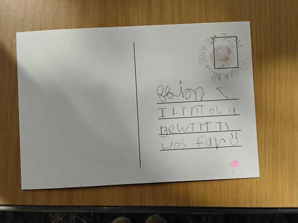 Back of postcard by , age 