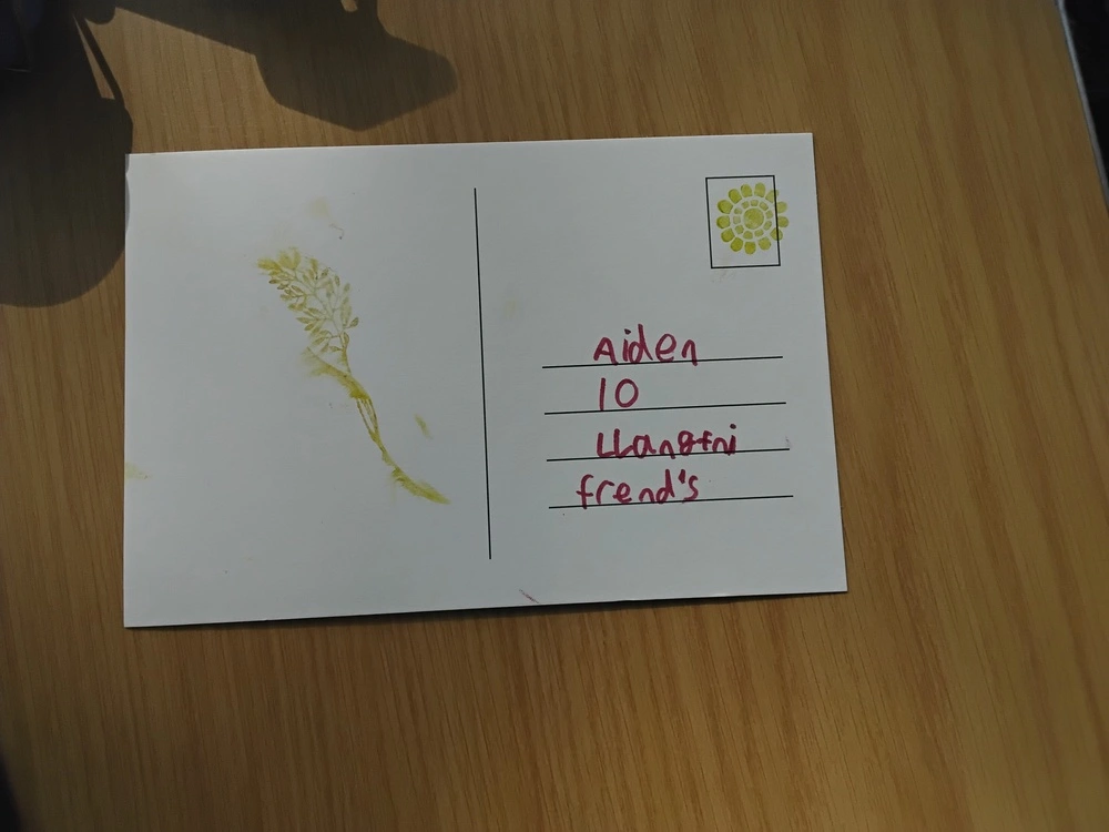 Back of postcard by , age 