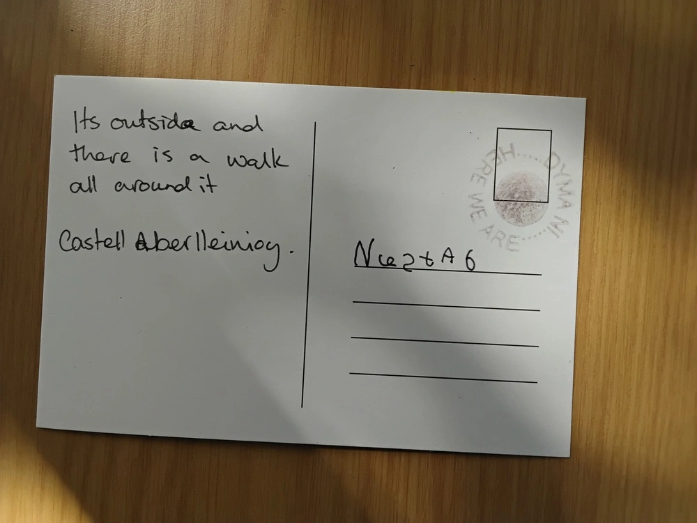 Back of postcard by , age 