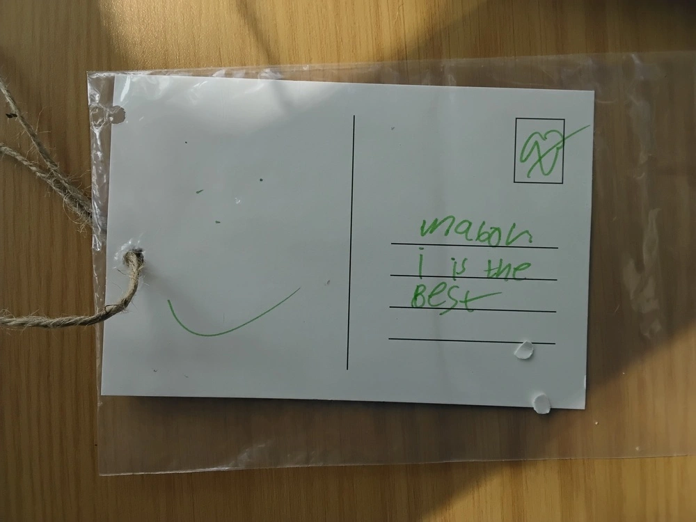 Back of postcard by , age 