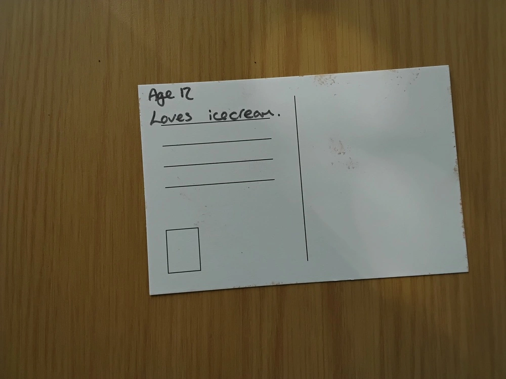 Back of postcard by , age 