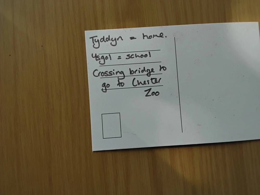 Back of postcard by , age 